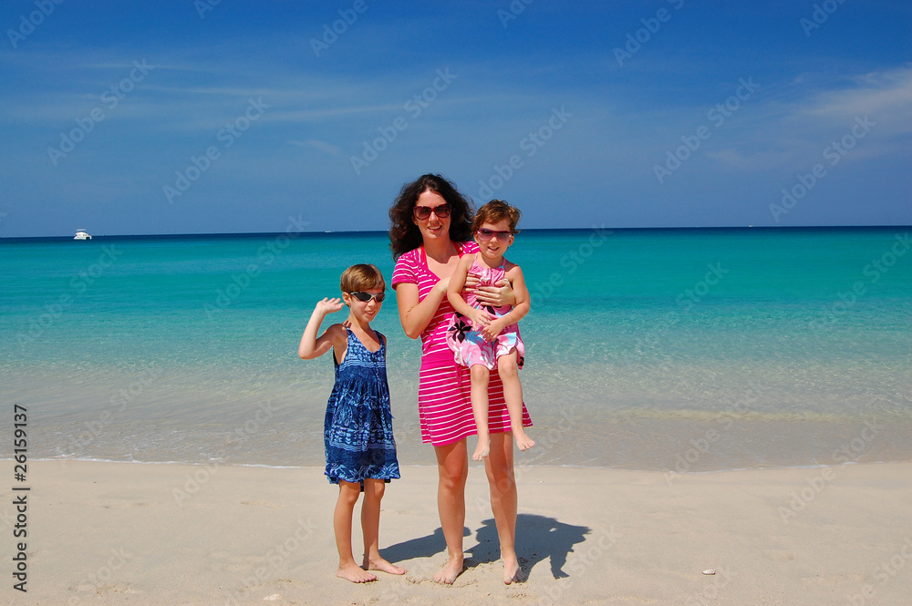 Mother with two daughters on beautiful tropical beach Mother with two daughters on beautiful tropical beach