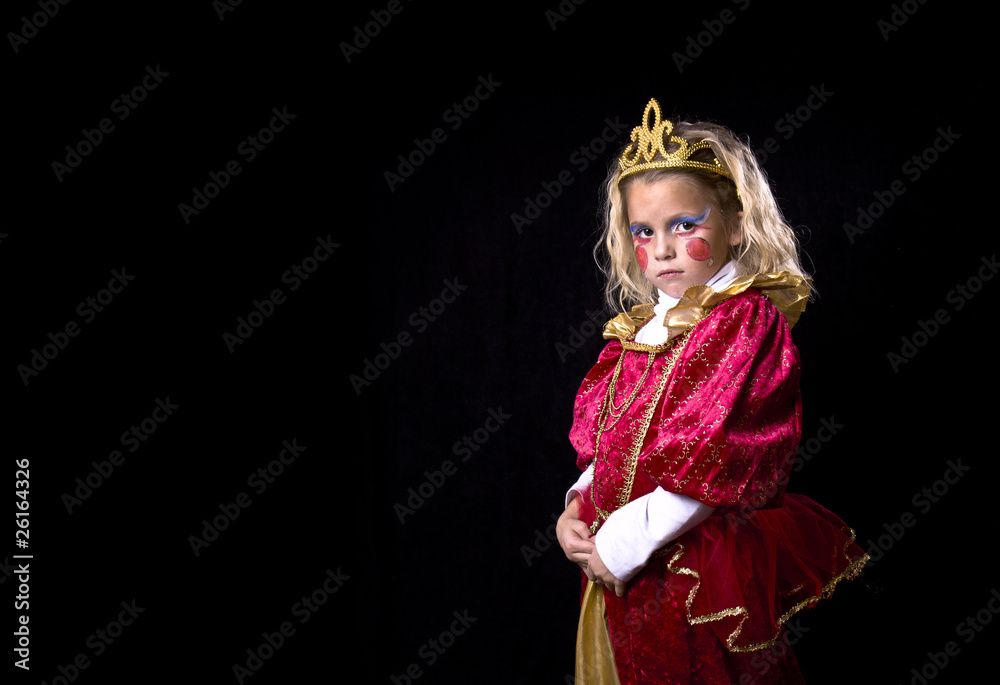 Adorable little girl in a princess costume on a black background Adorable little girl in a princess costume on a black background