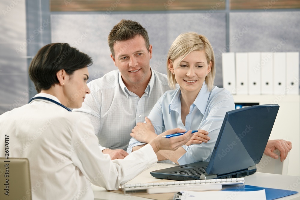 Doctor showing result to patients Doctor showing result to patients