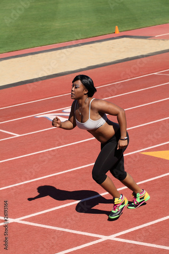 Young African American Woman Running on Track © jeffwqc