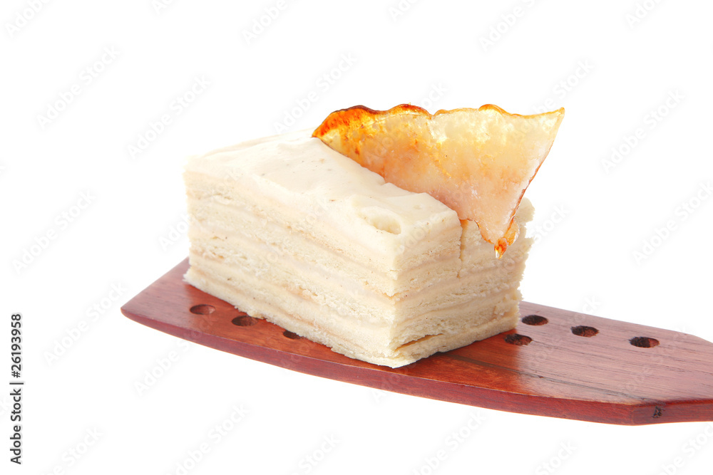 cream cake on wooden spatula