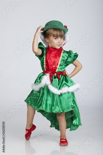 Beautiful little girl playing with hat on Saint Patrick's Day