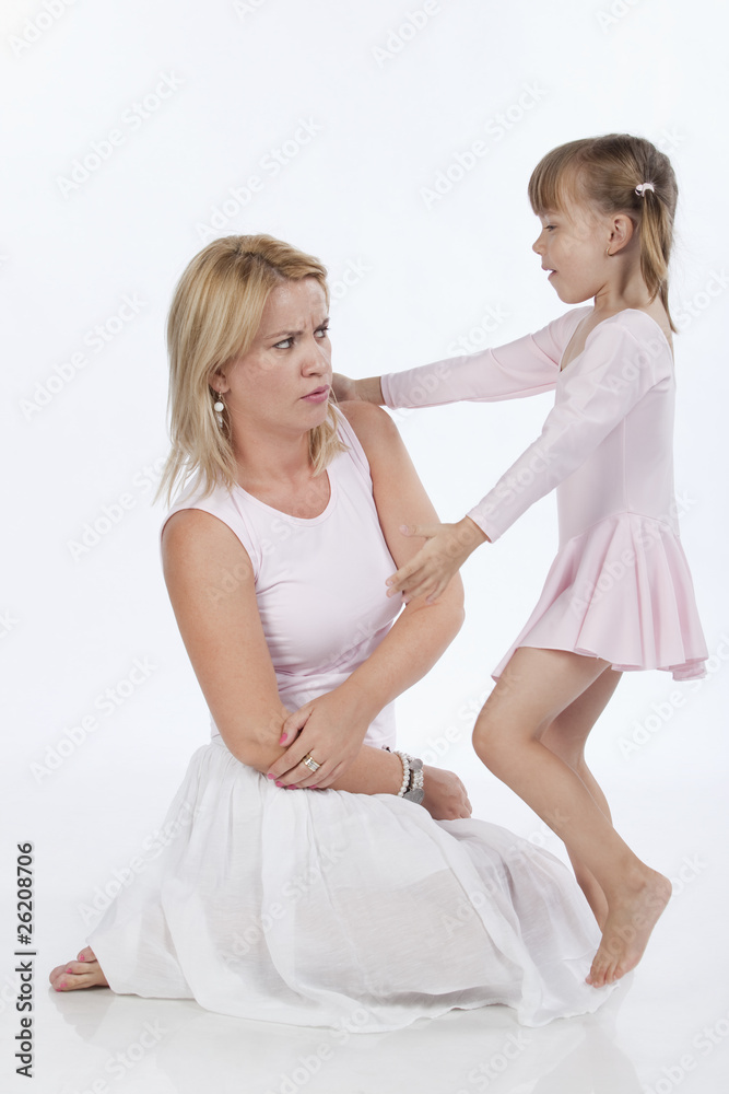 Young mother arguing with her little daughter