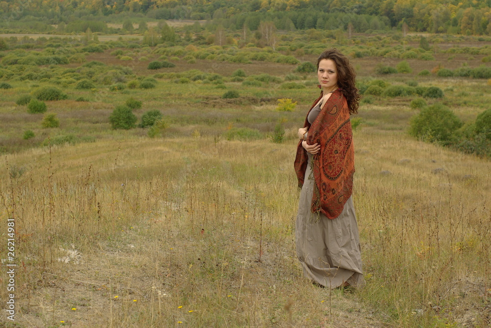 Female walking in the autumn field Female walking in the autumn field