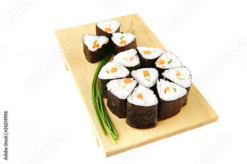 rolls of sushi on wood