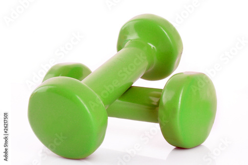 Couple of green dumbbells isolated on white