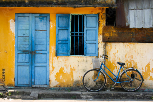 a bicycle and blue window photo