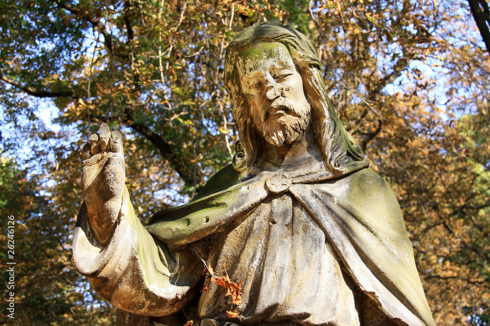 Obraz premium Ancient Jesus on a old Prague Cemetery