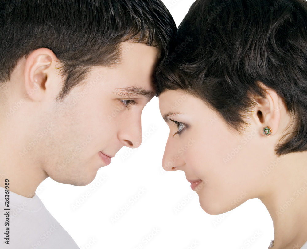 Profile of a smiling young couple in love Profile of a smiling young couple in love