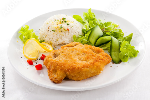 Fried pork chop with white rice and vegetable salad