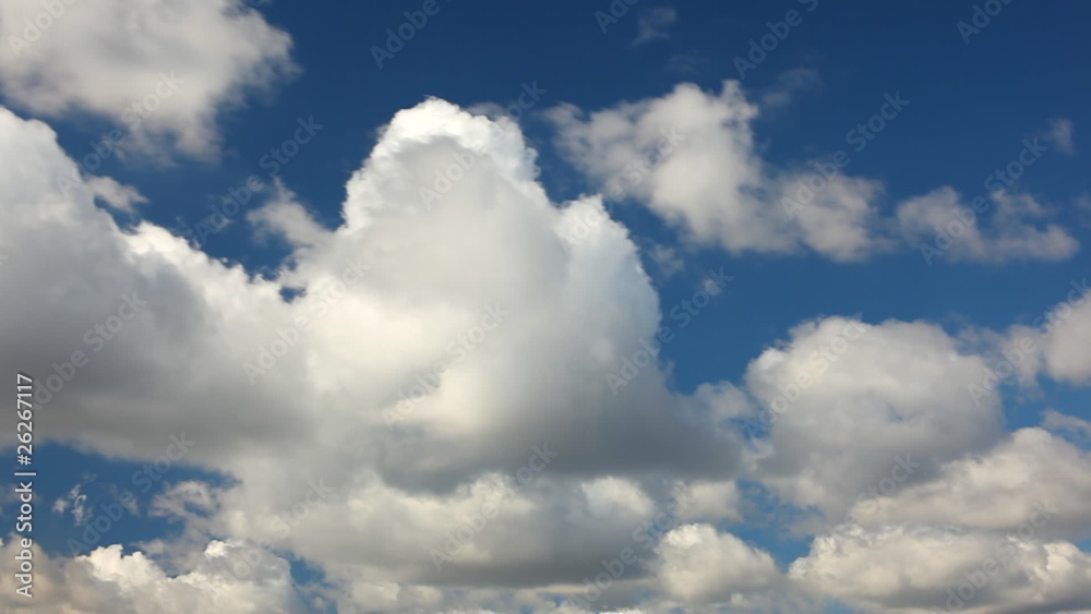 White clouds running over blue sky