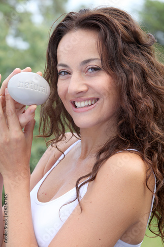 Closeup of beautiful woman holding stone