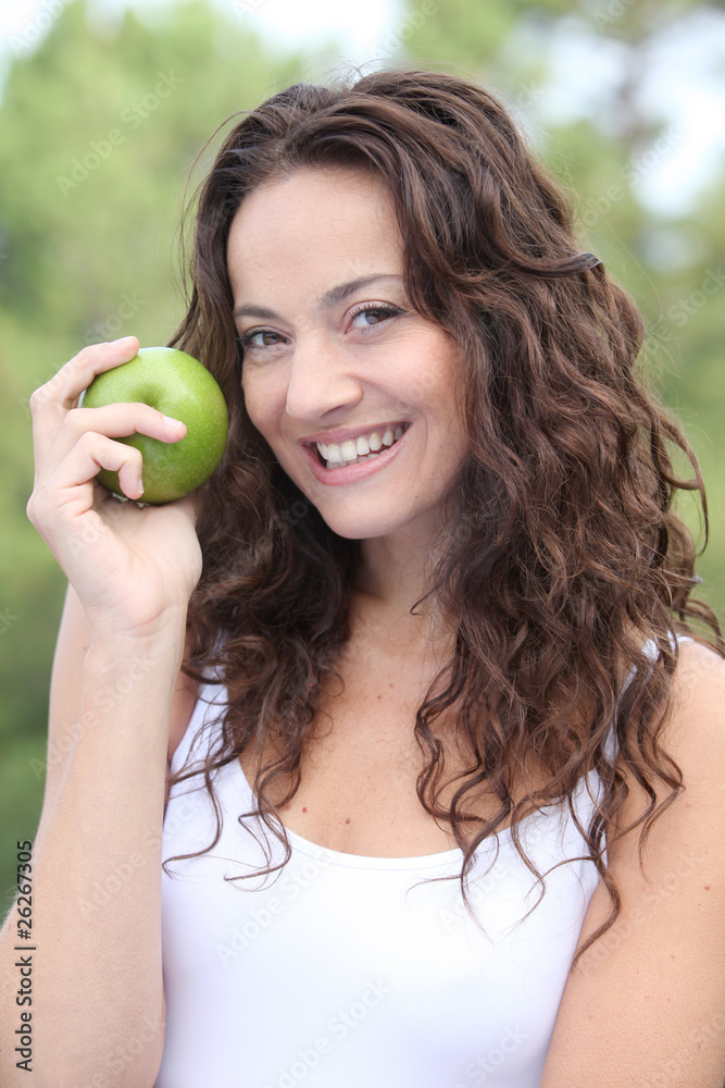 Closeup of woman eating a green apple Closeup of woman eating a green apple