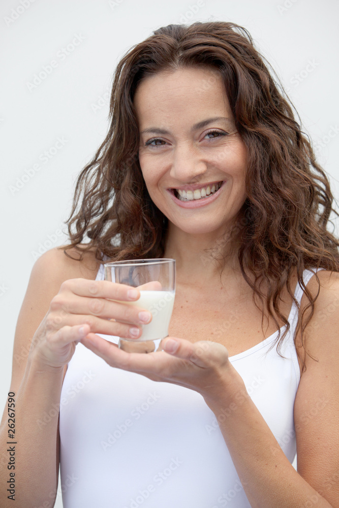 Closeup of beautiful woman drinking milk Closeup of beautiful woman drinking milk