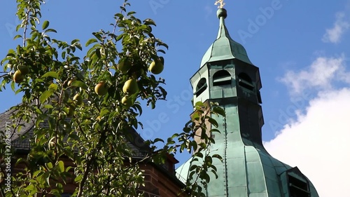 Kirchturm mit Obstbaum photo