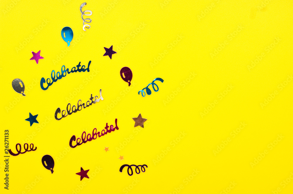 confetti on yellow background Stock Photo | Adobe Stock