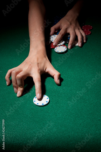Female Hands Grabbing Poker Chips