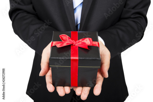businessman holding a gift package in hand .