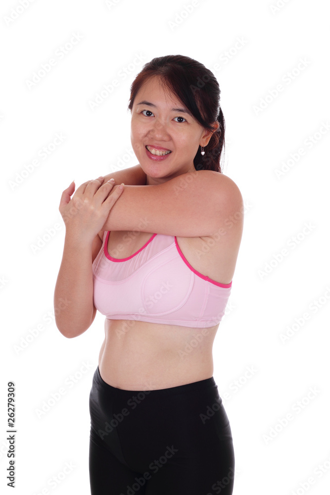 An Asian woman performing some stretching exercise An Asian woman performing some stretching exercise