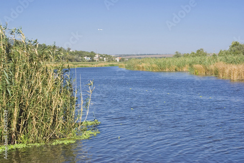 Autumnall Ukrainian landscape with rushy river.