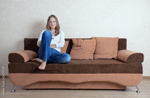 woman with laptop on the sofa © Kirill Polovnoy