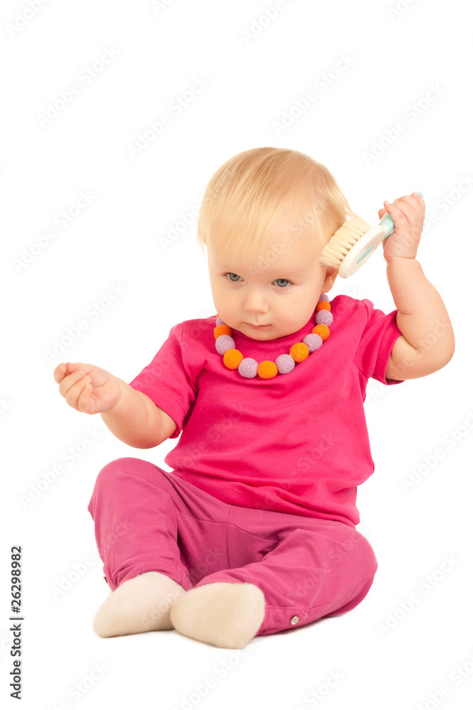 cute adorable baby play with comb on white cute adorable baby play with comb on white