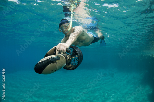 snorkeler on underwater scooter