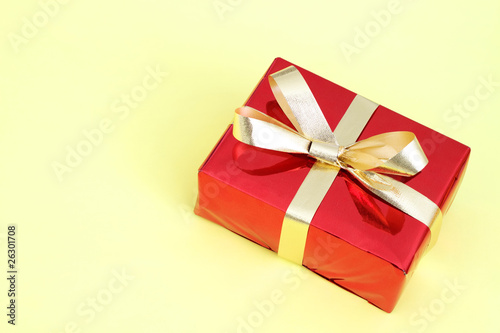 Red gift box on a yellow background