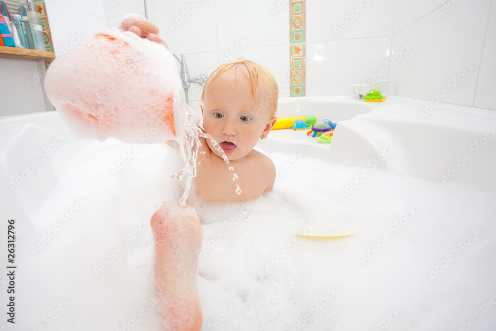A baby girl in a bathtub A baby girl in a bathtub