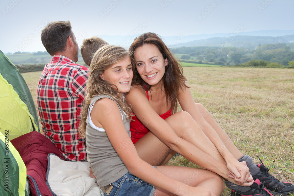 Fototapeta premium Parents and children in camp tent