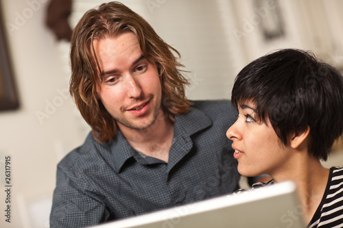 Happy Young Man and Woman U...