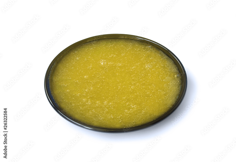 Fresh honey on the black saucer Fresh honey on the black saucer