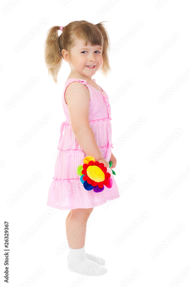 Little smiling girl with toy flower
