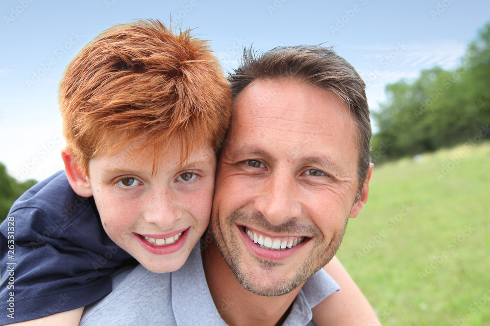 Closeup of father and son in countryside Closeup of father and son in countryside