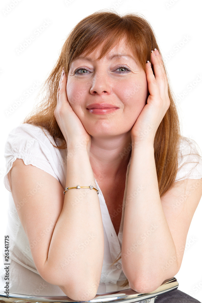 Fototapeta premium red-haired woman sitting in a chair