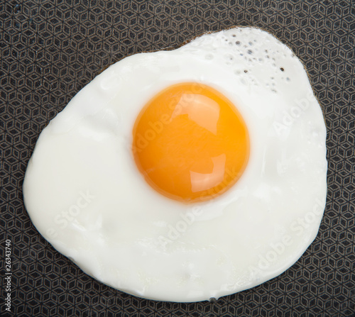 fried egg over pan