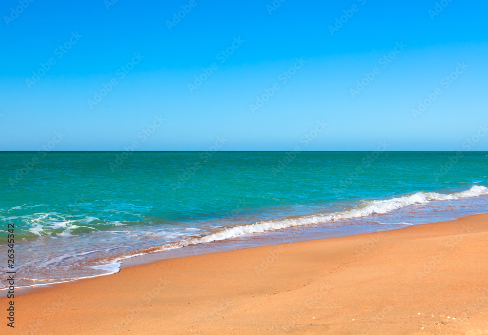 Sandy beach of seaside resort with clear water