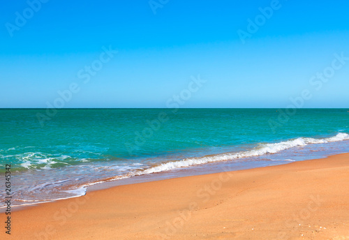 Sandy beach of seaside resort with clear water