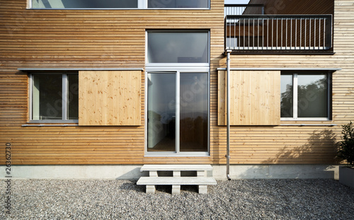 architettura moderna, esterno, porta finestre parte in legno photo