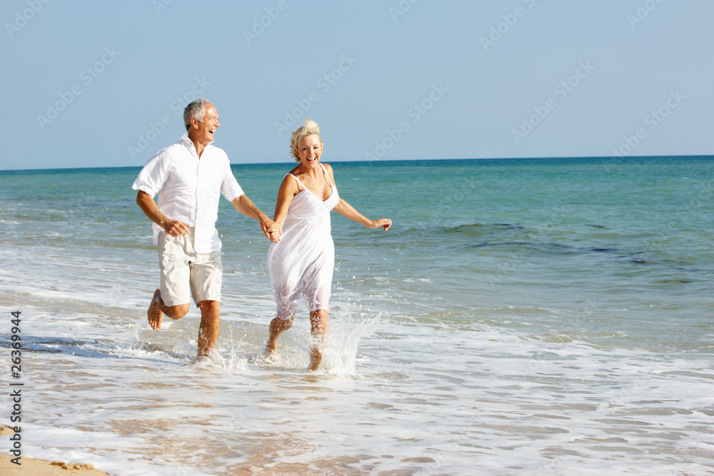 Senior Couple Enjoying Beach Holiday Senior Couple Enjoying Beach Holiday