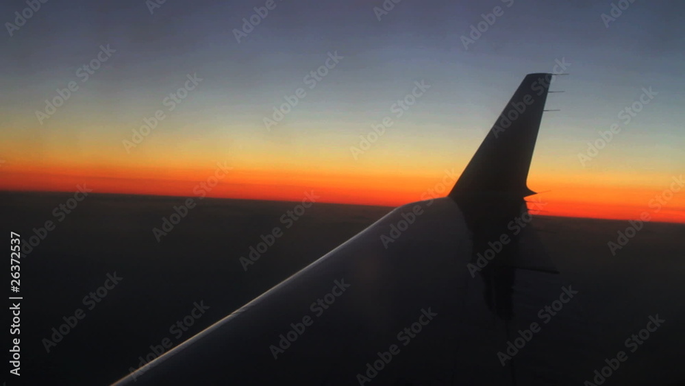 Aerial view of sunset over airplane wing Aerial view of sunset over airplane wing