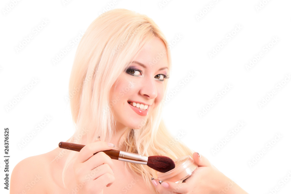 Portrait of attractive young blonde woman applying blusher Portrait of attractive young blonde woman applying blusher