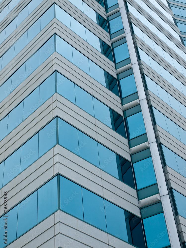 A Highrise Office Building made of Concrete and Glass A Highrise Office Building made of Concrete and Glass