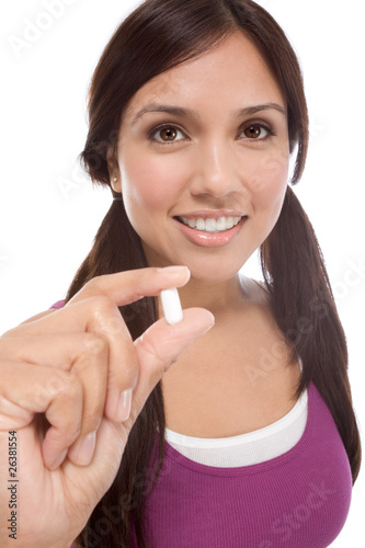 Hispanic teen girl with medicine pill
