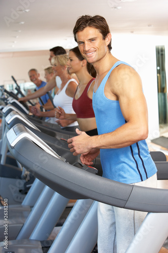 Man On Running Machine In Gym