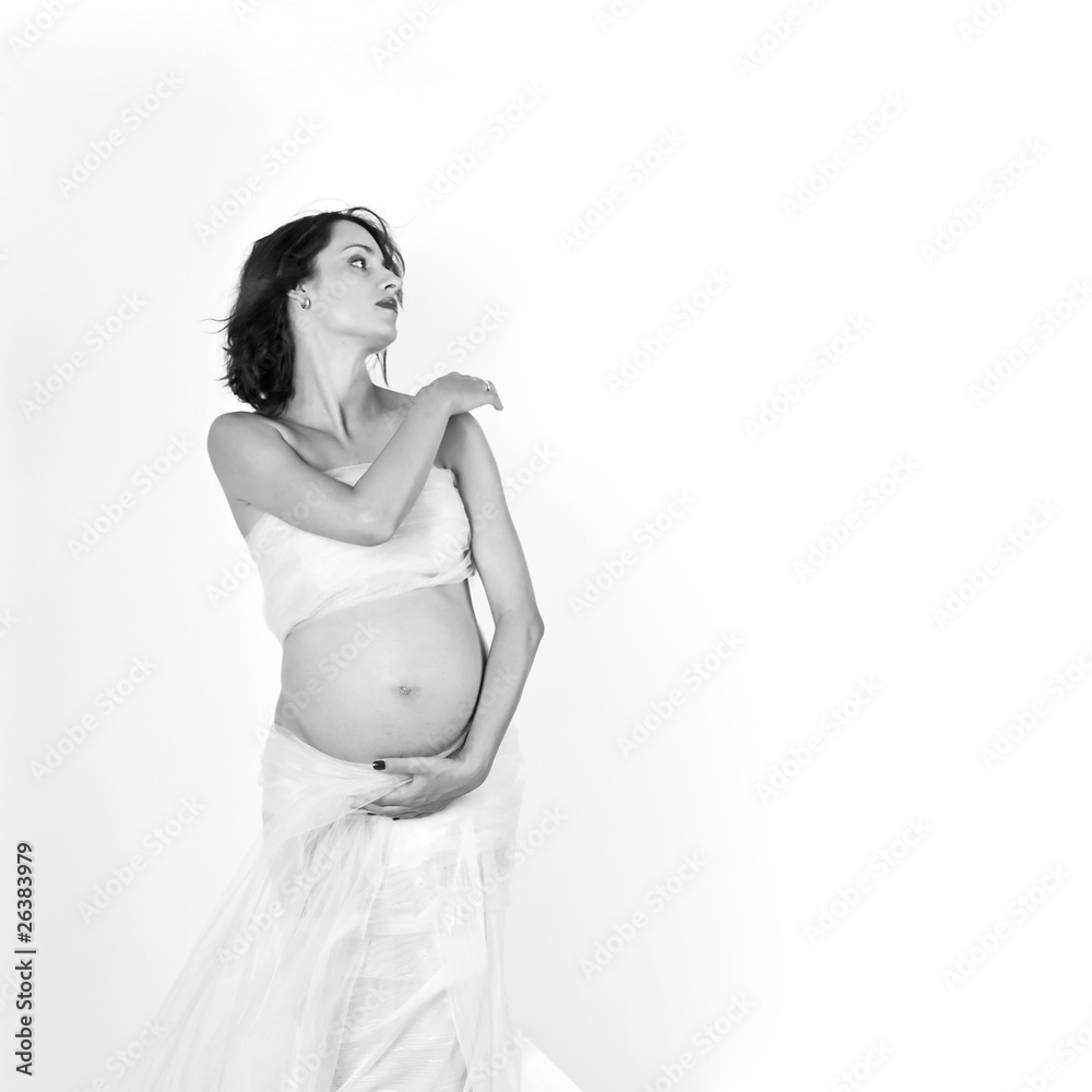 Beautiful young pregnant mother isolated on white Beautiful young pregnant mother isolated on white