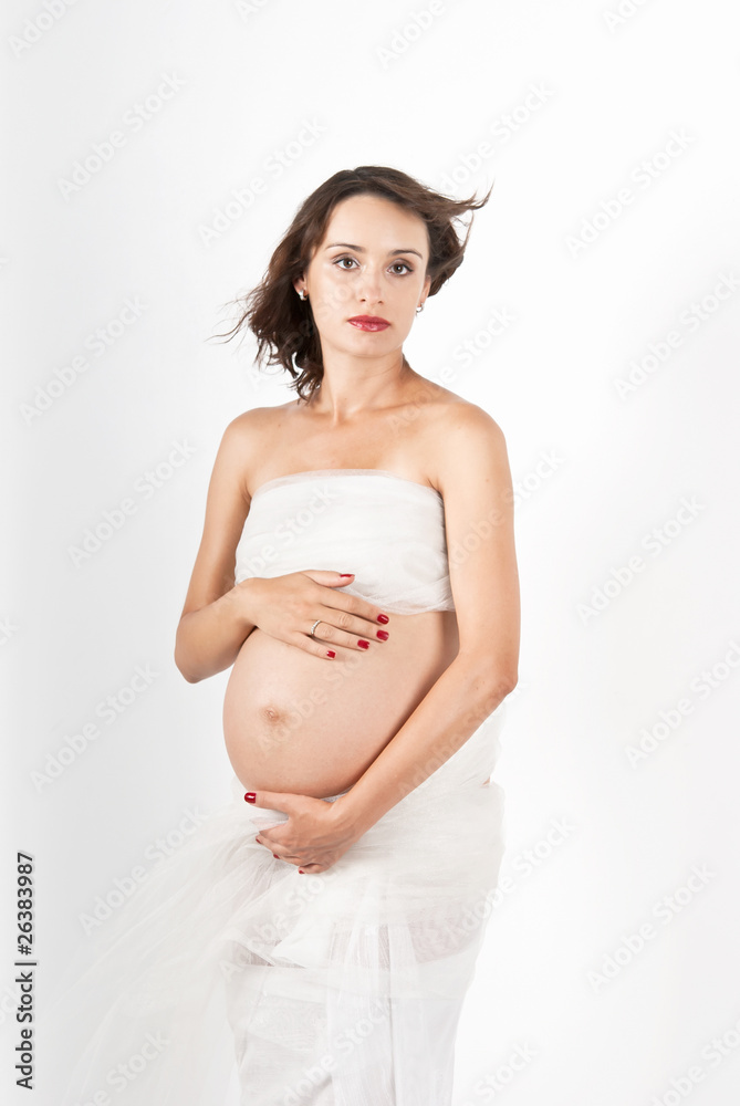 Beautiful young pregnant mother isolated on white Beautiful young pregnant mother isolated on white
