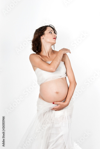 Beautiful young pregnant mother isolated on white © Olena Svechkova