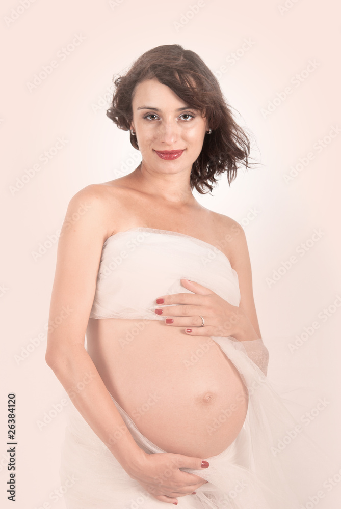 Beautiful young pregnant mother isolated on white Beautiful young pregnant mother isolated on white