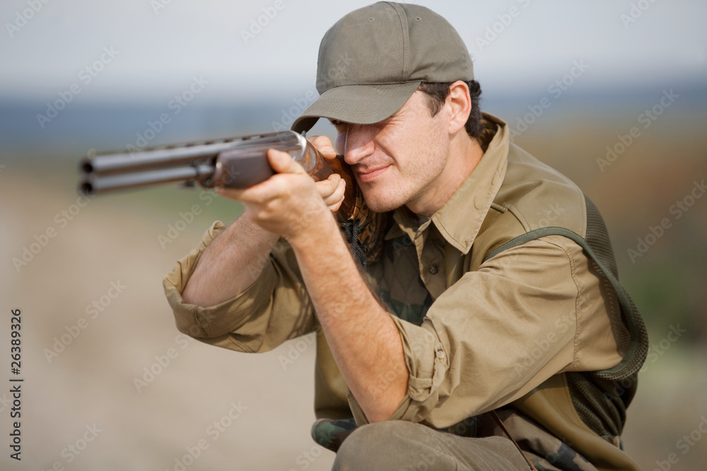 Fototapeta premium Hunter aiming at the hunt during a hunting party